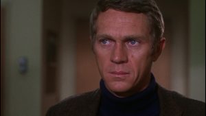 Actor Steve McQueen in a screenshot from the movie Bullitt.