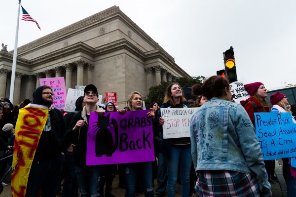 Inauguration Day: A group of protestors gather just outside of the National Achieves Building at Constitution Ave NW and 7th St NW after the Inaugural ceremony had concluded. (Michael Jordan)