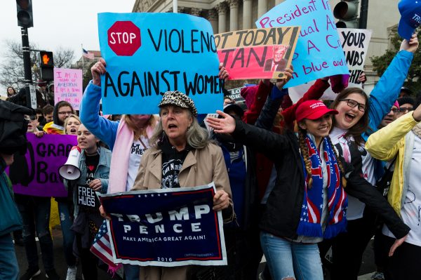 Inauguration Day: Three women who were Trump supporters clash with Trump protestors who gather just outside of the National Achieves Building at Constitution Ave NW and 7th St NW after the Inaugural ceremony concluded. (Michael Jordan)