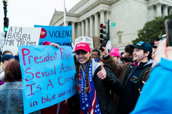 Inauguration Day: A Trump supporter responds to the chants of Trump protesters who gather just outside of the National Achieves Building at Constitution Ave NW and 7th St NW after the Inaugural ceremony concluded. (Michael Jordan)