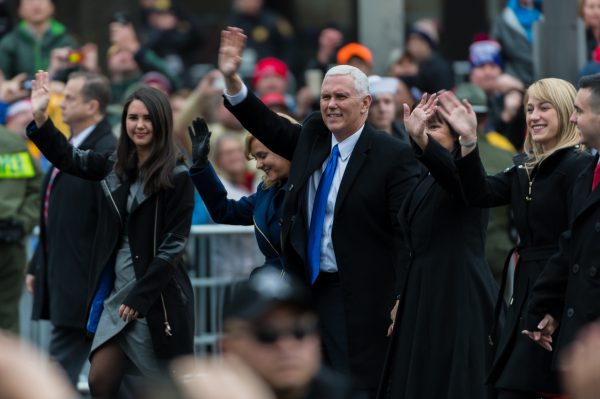The Pence family moments after exiting their vehicle to walk along the parade route at Pennsylvania Ave and 10th St NW. (Michael Jordan)