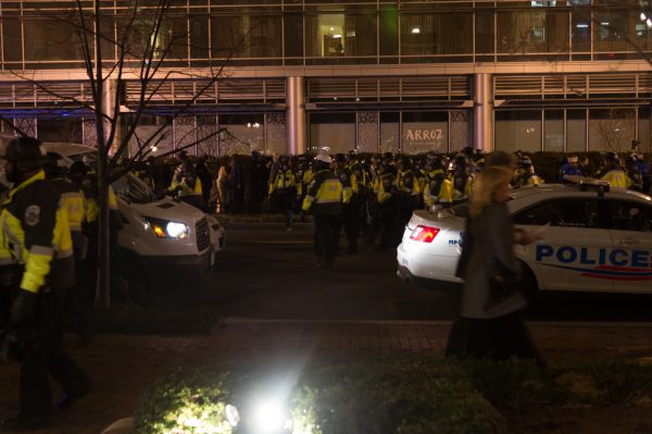 Police in riot formation push back unruly protestors who just charged the lobby of the Marriott Hotel across from the Henley Park Hotel. Michael Jordan)