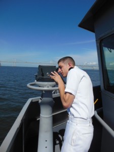 Midshipman carefully checks the ships bearings. (Anthony C. Hayes) 