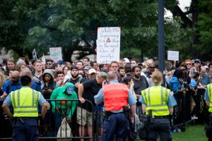 Washington, DC. Aug 12, 2018: "Unite the Right 2" made up less than a few dozen people in their ultra secure zone on Lafayette Square. Journalists and Photographers vastly outnumbered the protesters in this areas. Just across the square perhaps a thousand people gathered in counter protest. (Mike Jordan/BPE)