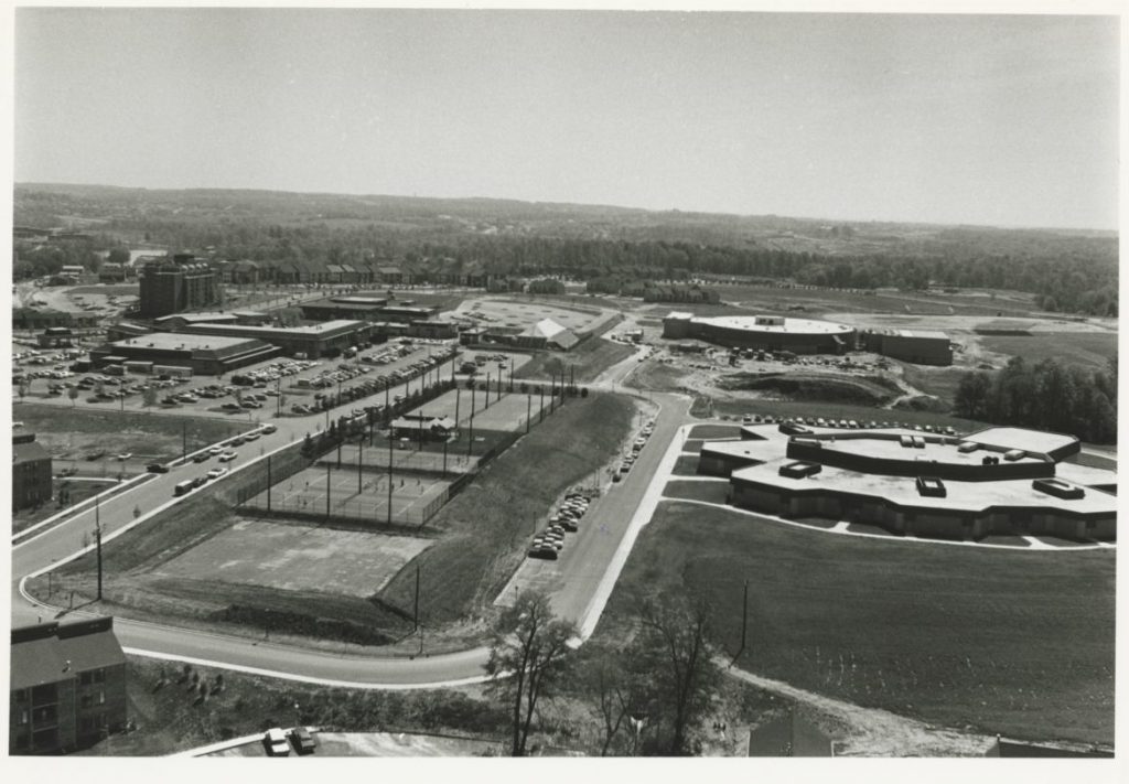 Wilde Lake Middle School, middle right, and Wilde Lake High School, upper right, were next to the village center. Morton Tadder photo. Courtesy of Columbia Archives 