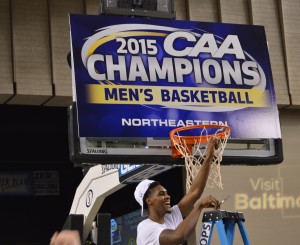 Quincy Ford takes his turn cutting down the net following Northeastern's 72-61 win over William & Mary in the CAA Tournament final. (Costa Swanson)