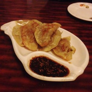 Crispy, savory gyoza filled with beef and served with a peppery sauce (Lauren Molander)